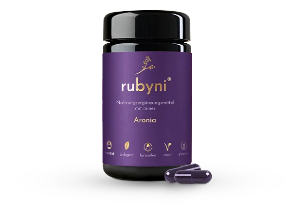 rubyni Aronia – vegan, glutenfrei & biologisch Dunkles Glasfläschchen rubyni Aronia – biologisches, veganes und glutenfreies Nahrungsergänzungsmittel auf weißem Hintergrund